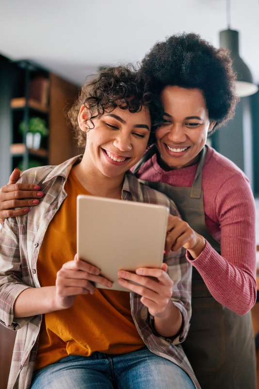 Mother and daughter engaged in Family Digital Memories Preservation Activity